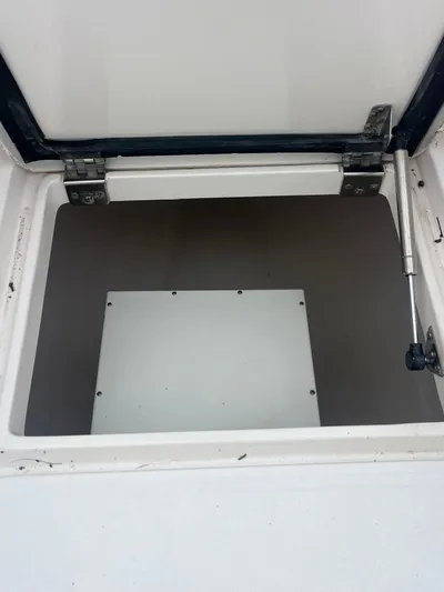Agitator Yacht Photos Pics Open storage compartment on a 2016 Intrepid 327 Center Console boat.