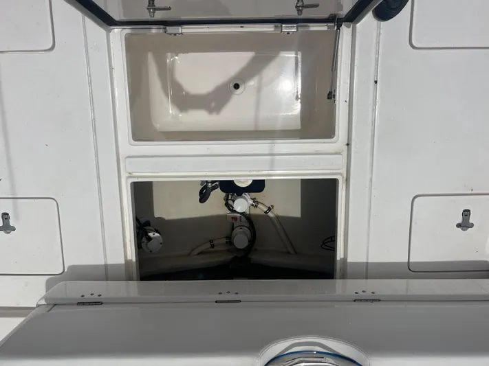 Agitator Yacht Photos Pics 2016 Intrepid 327 Center Console boat storage compartments and equipment.