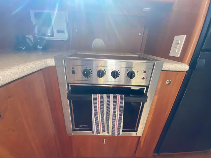 Aqua Holic Yacht Photos Pics Stainless steel oven in 2002 Silverton 43 MY yacht kitchen.