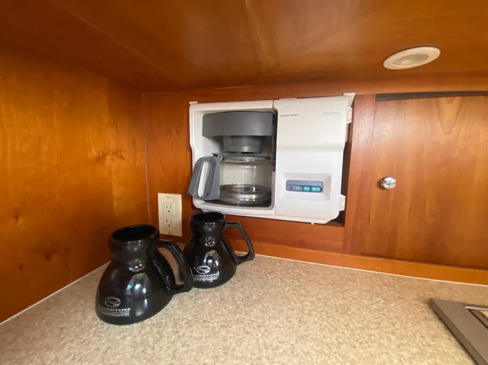 Aqua Holic Yacht Photos Pics Built-in coffee maker and mugs in 2002 Silverton 43 MY yacht kitchen.