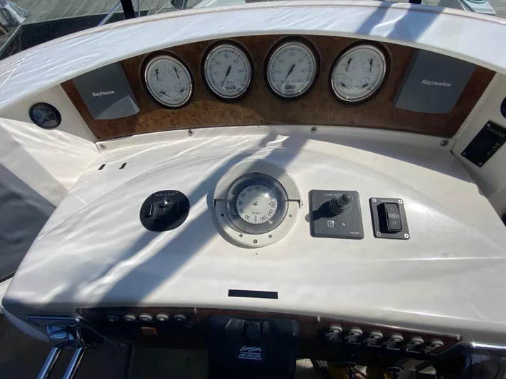 Aqua Holic Yacht Photos Pics 2002 Silverton 43 MY yacht dashboard with gauges and navigation controls.