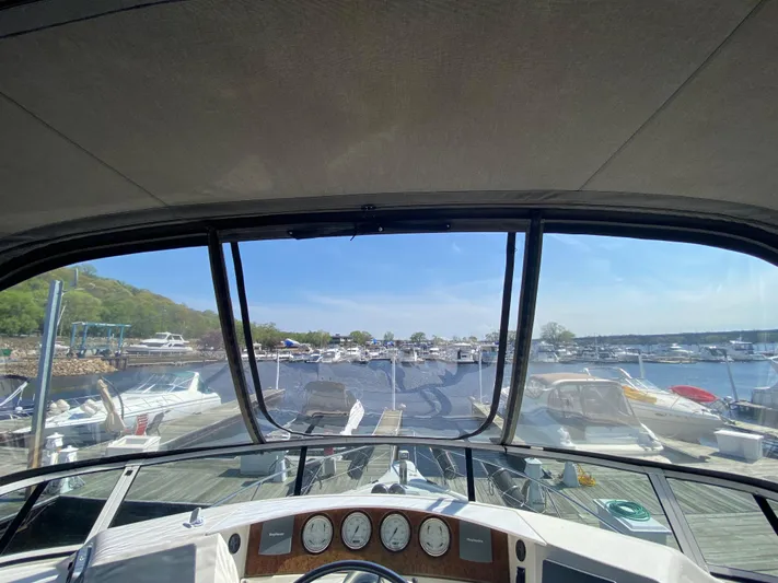 Aqua Holic Yacht Photos Pics View from 2002 Silverton 43 MY yacht helm, overlooking marina with docked boats.