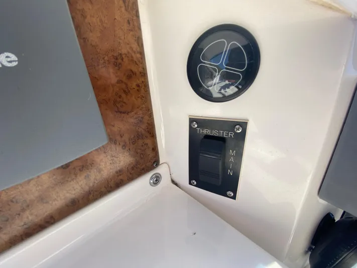 Aqua Holic Yacht Photos Pics Control panel of a 2002 Silverton 43 MY boat, featuring a thruster switch.