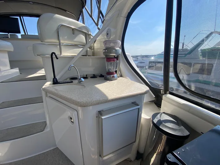 Aqua Holic Yacht Photos Pics 2002 Silverton 43 MY yacht interior with kitchenette, featuring a sink and blender.