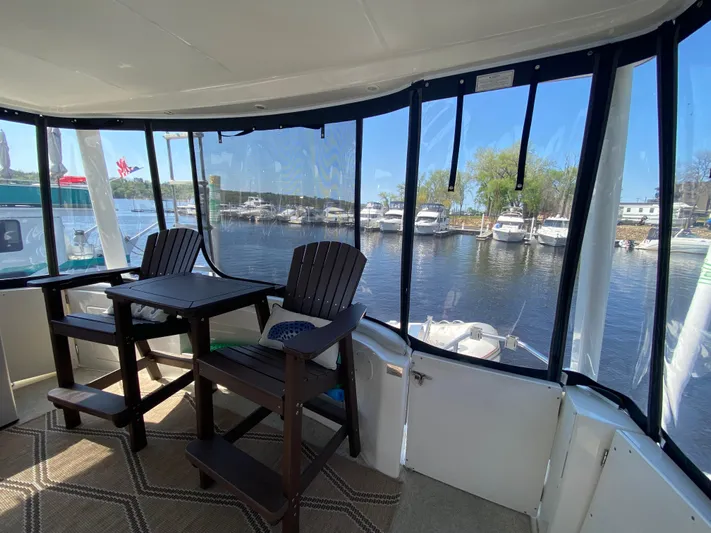 Aqua Holic Yacht Photos Pics Interior view of 2002 Silverton 43 MY yacht with marina backdrop.