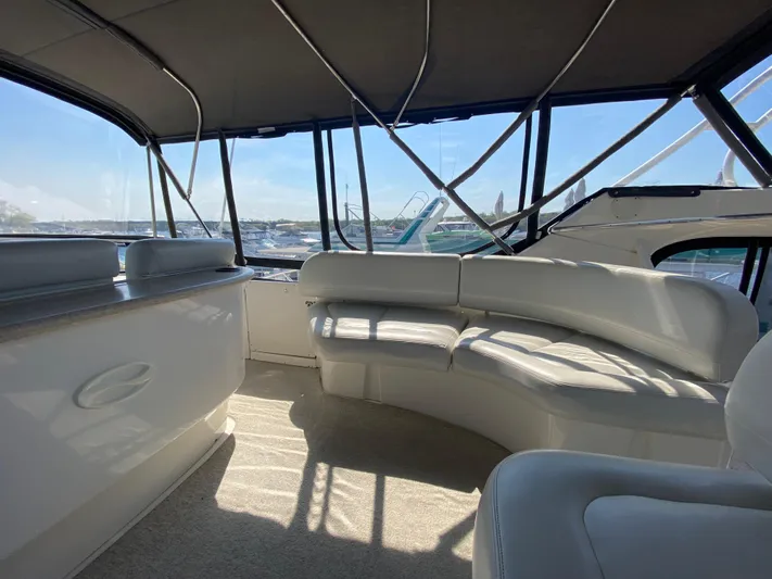 Aqua Holic Yacht Photos Pics Interior of 2002 Silverton 43 MY yacht with spacious seating and panoramic windows.