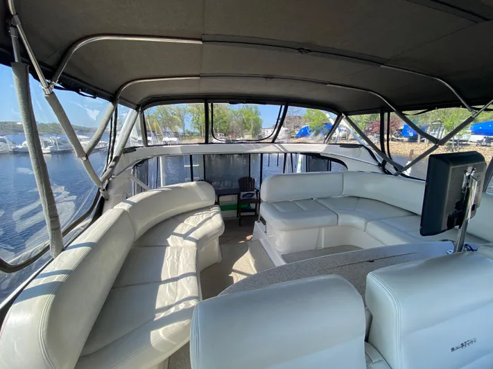 Aqua Holic Yacht Photos Pics Interior of 2002 Silverton 43 MY yacht with spacious seating and panoramic windows.