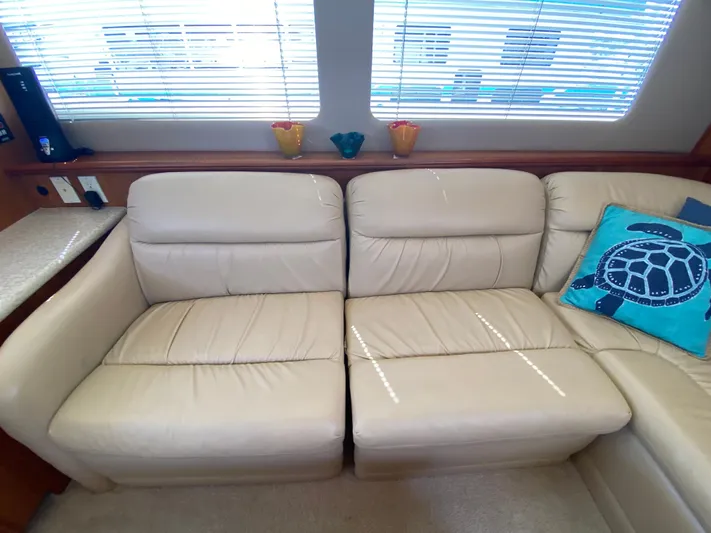 Aqua Holic Yacht Photos Pics Luxurious beige leather seating in 2002 Silverton 43 MY yacht interior.