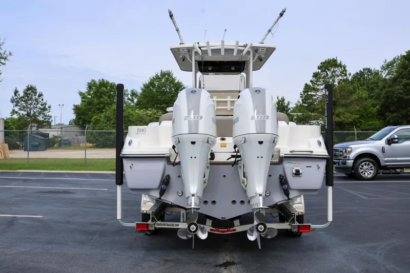  Yacht Photos Pics 2023 Key West 263 FS boat with dual Yamaha 200 engines, parked outdoors.