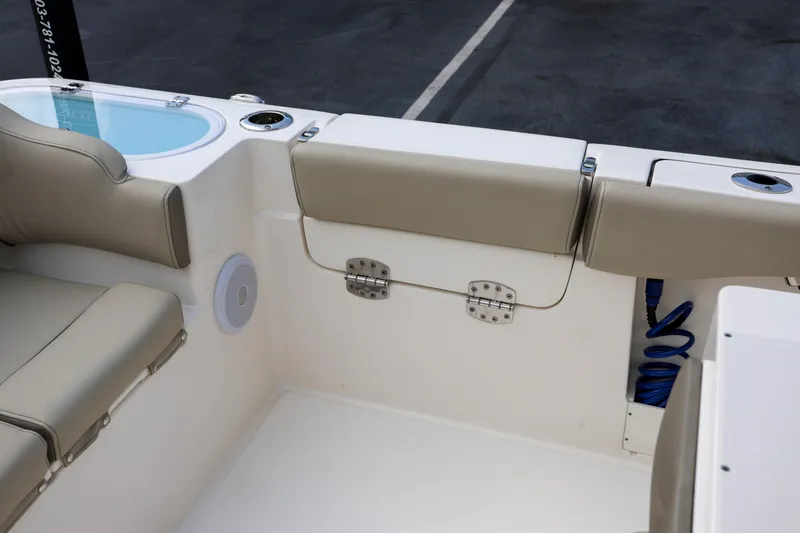  Yacht Photos Pics 2023 Key West 263 FS boat interior with cushioned seating and storage.