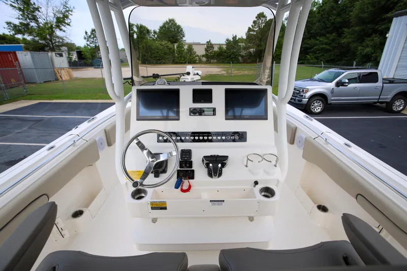  Yacht Photos Pics 2023 Key West 263 FS boat dashboard with dual screens and steering wheel.