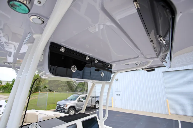  Yacht Photos Pics 2023 Key West 263 FS boat interior with overhead storage compartments and modern design.