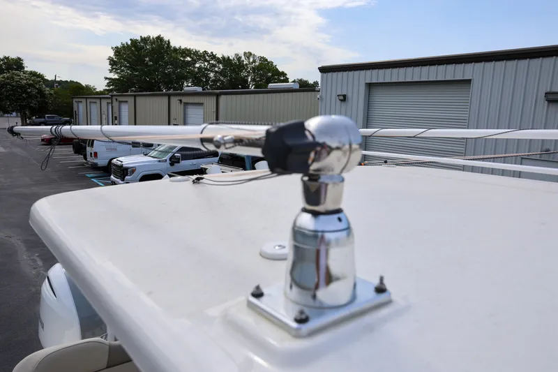  Yacht Photos Pics 2023 Key West 263 FS boat with mounted antenna in a parking lot.