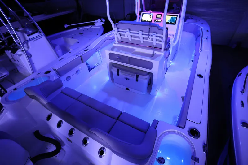  Yacht Photos Pics 2023 Key West 263 FS boat interior with blue LED lighting and modern dashboard.