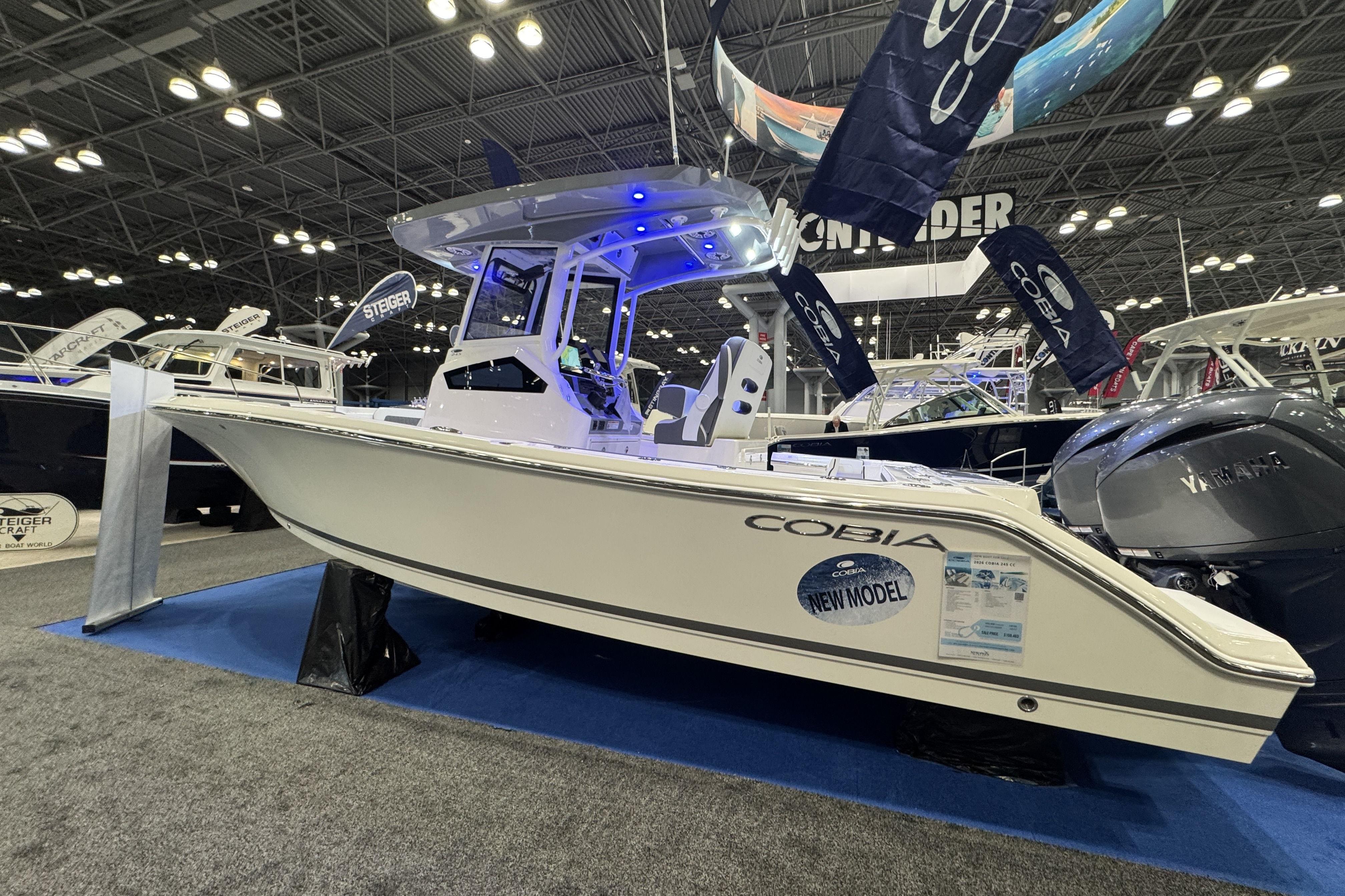 2026 Cobia 245 Center Console boat displayed at an indoor boat show.