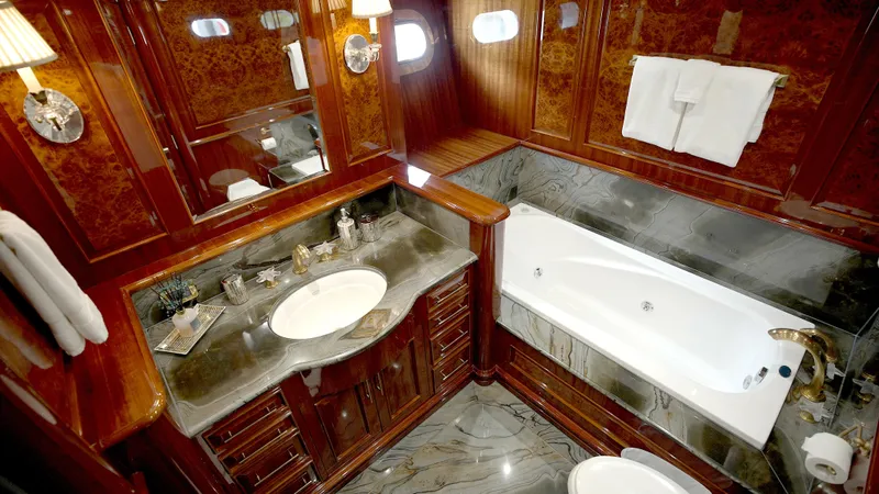 Homecoming Yacht Photos Pics Luxurious yacht bathroom with marble countertops and bathtub, Horizon 136 Premier, 2010 model.