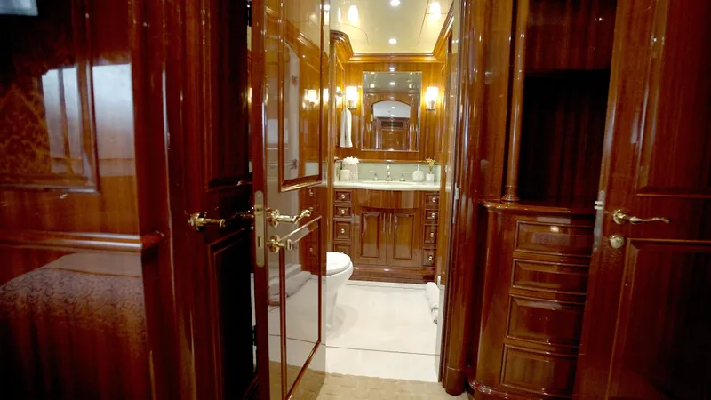 Homecoming Yacht Photos Pics Luxurious wooden interior of 2010 Horizon 136 Premier yacht bathroom.