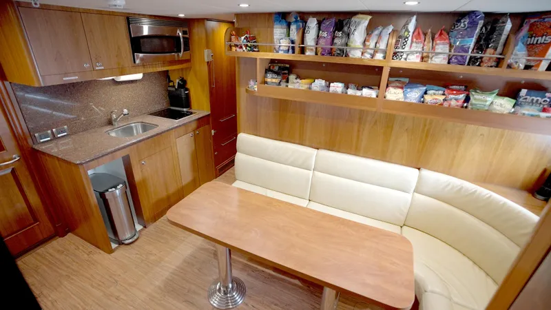 Homecoming Yacht Photos Pics Luxurious yacht kitchen with seating, Horizon 136 Premier, 2010 model.