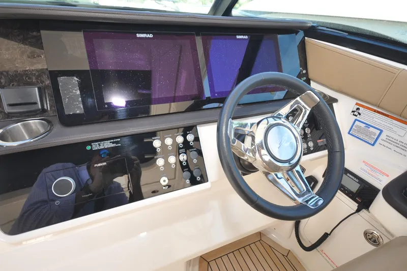  Yacht Photos Pics 2020 Sea Ray Sundancer 320 helm with modern controls and Simrad navigation system.
