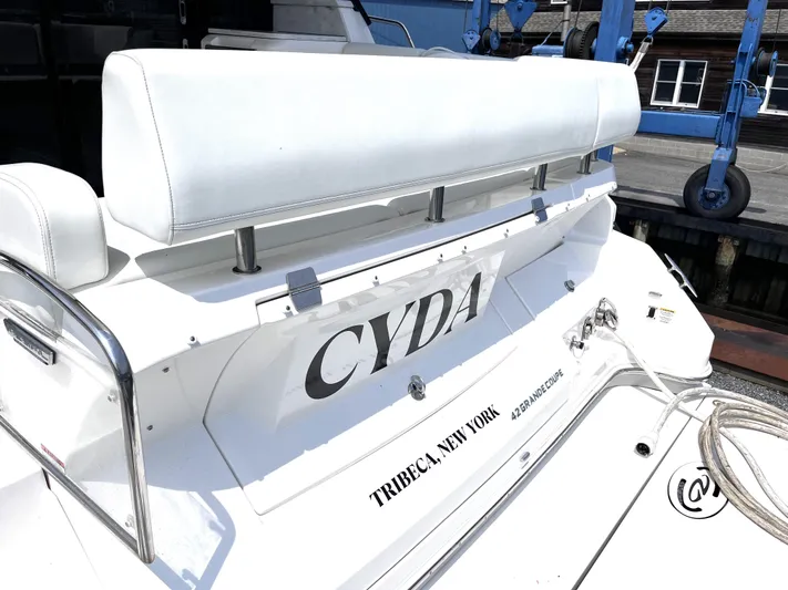  Yacht Photos Pics 2022 Regal 42 Grande Coupe yacht stern with CYDA name, docked in Tribeca, New York.