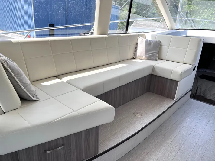  Yacht Photos Pics Luxurious seating area inside a 2022 Regal 42 Grande Coupe yacht.