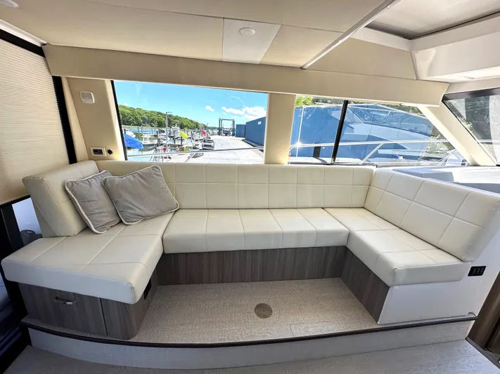  Yacht Photos Pics Luxurious interior seating of the 2022 Regal 42 Grande Coupe yacht.