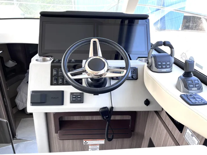  Yacht Photos Pics 2022 Regal 42 Grande Coupe helm with modern controls and touchscreen display.