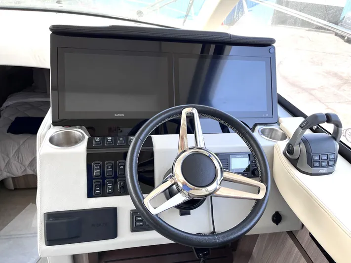  Yacht Photos Pics 2022 Regal 42 Grande Coupe helm with dual screens and modern controls.