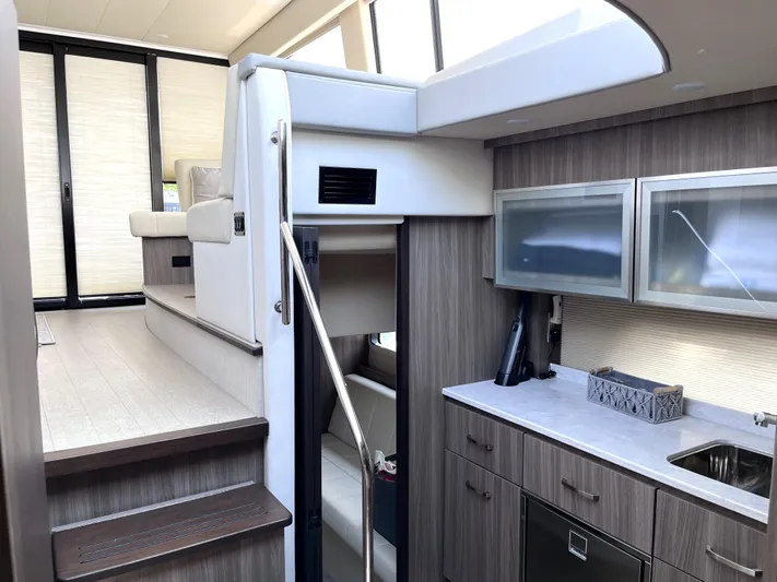  Yacht Photos Pics Interior of 2022 Regal 42 Grande Coupe yacht with modern kitchen and stairs.