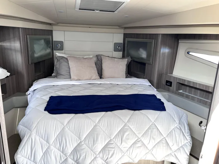 Yacht Photos Pics Luxurious bedroom interior of 2022 Regal 42 Grande Coupe yacht.