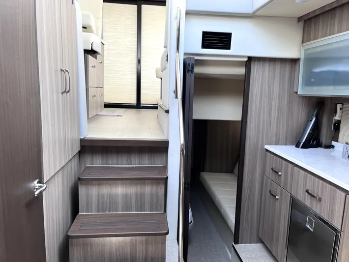  Yacht Photos Pics Interior of 2022 Regal 42 Grande Coupe yacht with modern wood finish.