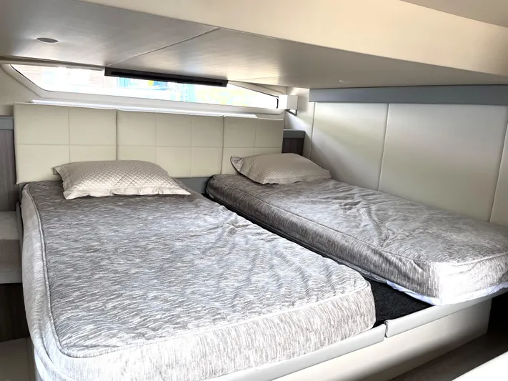  Yacht Photos Pics 2022 Regal 42 Grande Coupe twin beds in modern cabin interior.