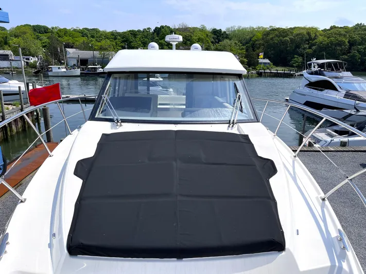  Yacht Photos Pics 2022 Regal 42 Grande Coupe yacht docked at a marina.