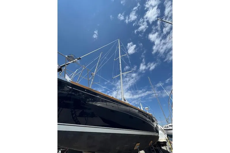 Serendipity II Yacht Photos Pics Sailboat Sabre 452 from 1999 under a clear blue sky with clouds.