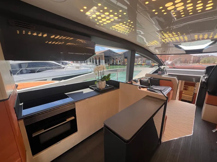  Yacht Photos Pics Luxurious interior of 2025 Astondoa 677 Coupe yacht with modern design and waterfront view.