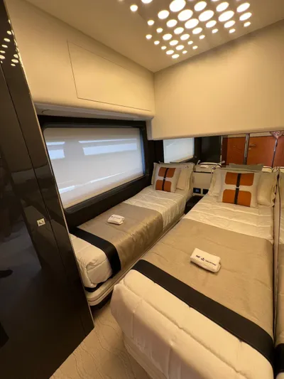  Yacht Photos Pics Luxury twin bedroom in 2025 Astondoa 677 Coupe yacht, featuring modern design and elegant decor.