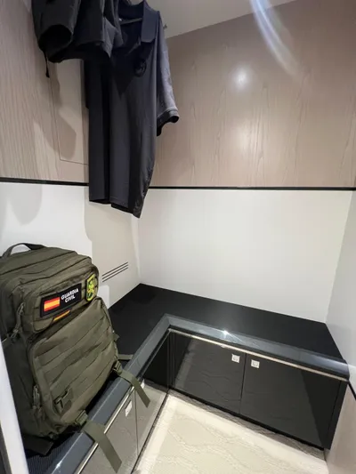  Yacht Photos Pics Interior of 2025 Astondoa 677 Coupe with modern storage and hanging clothes.