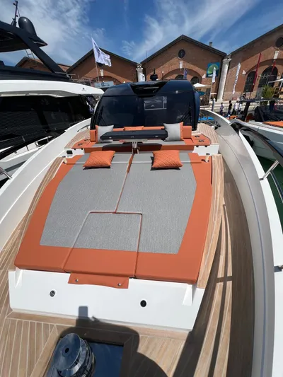  Yacht Photos Pics 2025 Astondoa 677 Coupe yacht with sleek design and sunbathing area.