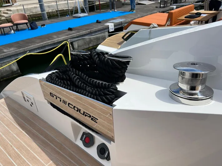  Yacht Photos Pics 2025 Astondoa 677 Coupe yacht deck with mooring equipment and sleek design.