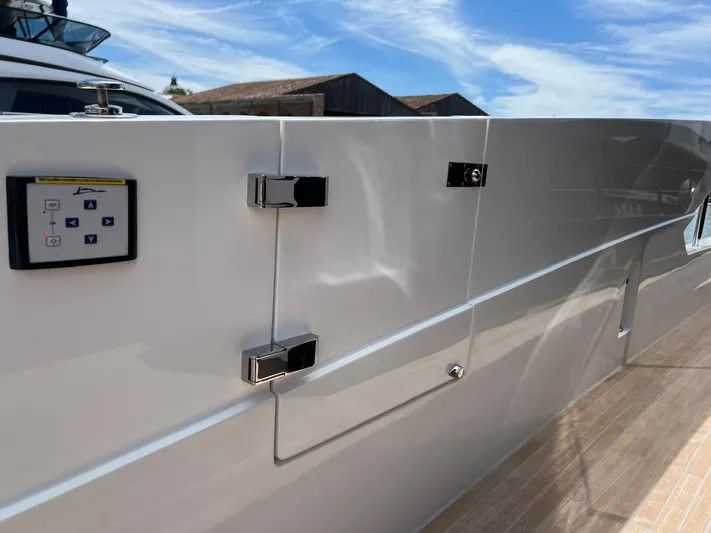  Yacht Photos Pics 2025 Astondoa 677 Coupe yacht exterior with sleek design and control panel.