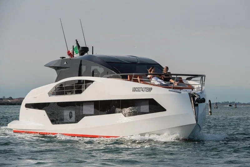  Yacht Photos Pics 2025 Astondoa 677 Coupe luxury yacht cruising on open water.