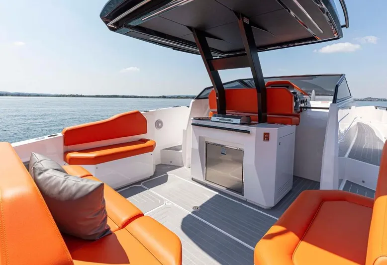  Yacht Photos Pics 2025 Rio Yachts Daytona 35 with vibrant orange seating on a sunny day at sea.