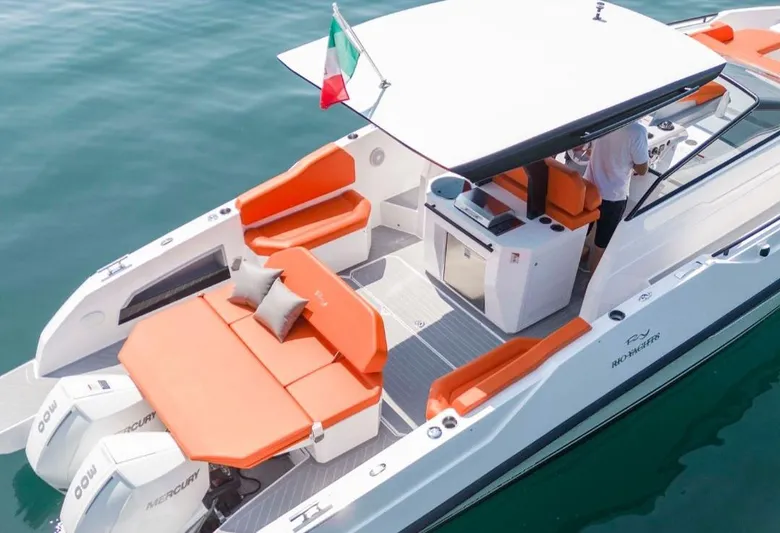  Yacht Photos Pics 2025 Rio Yachts Daytona 35 with orange seating, Italian flag, and twin Mercury engines.
