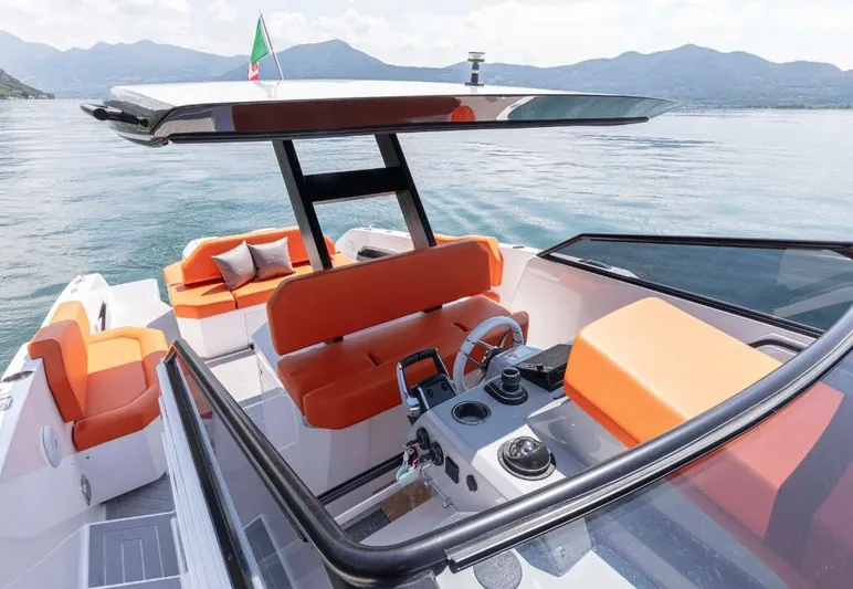  Yacht Photos Pics 2025 Rio Yachts Daytona 35 with orange seating, sleek design, and scenic lake backdrop.