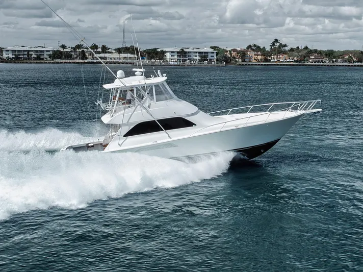 Aegis Yacht Photos Pics 2009 Viking 54 Convertible yacht cruising on open water.