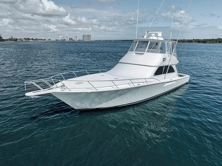Aegis Yacht Photos Pics 2009 Viking 54 Convertible yacht on open water, under a partly cloudy sky.
