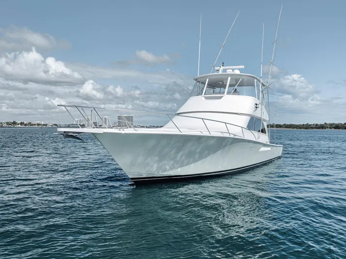 Aegis Yacht Photos Pics 2009 Viking 54 Convertible yacht on open water under a cloudy sky.