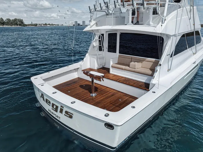 Aegis Yacht Photos Pics 2009 Viking 54 Convertible yacht on water, featuring spacious deck and seating area.