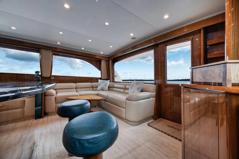 Aegis Yacht Photos Pics Luxurious interior of 2009 Viking 54 Convertible yacht with plush seating and elegant wood finishes.