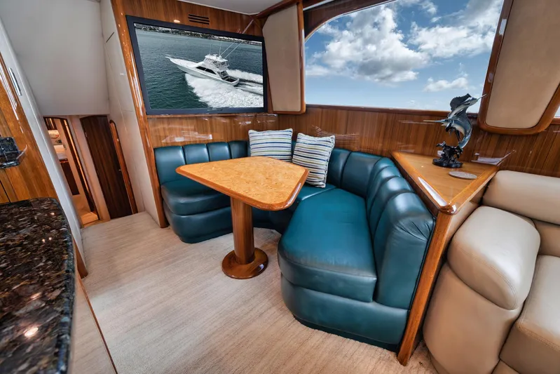 Aegis Yacht Photos Pics Luxurious interior of 2009 Viking 54 Convertible yacht with plush seating and elegant decor.